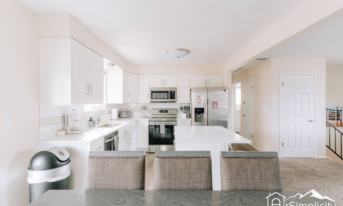 Wheat Ridge Apartment | Bright & Chic Getaway Game Room Covered Deck