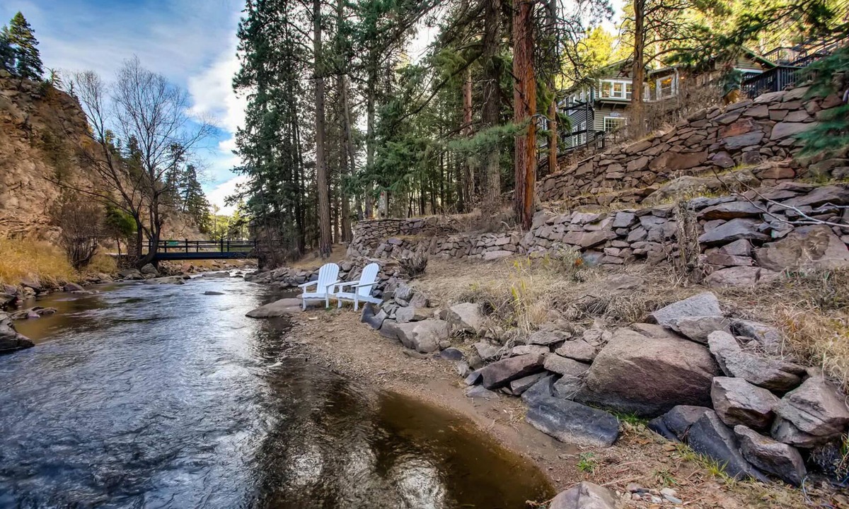 Evergreen House | Timeless 100 Year Old Creekside Cabin near Red Rocks. King size bed.