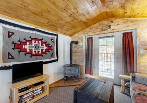 Mountain-view studio with private balcony, wood stove, and fast WiFi