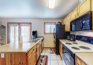 Riverfront condo with free wifi, fireplace, patio, & gas grill