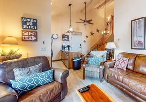 Ski-in/ski-out retreat with wraparound decks, hot tubs, ski views