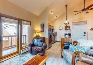 Ski-in/ski-out retreat with wraparound decks, hot tubs, ski views