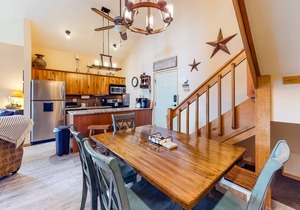 Ski-in/ski-out retreat with wraparound decks, hot tubs, ski views