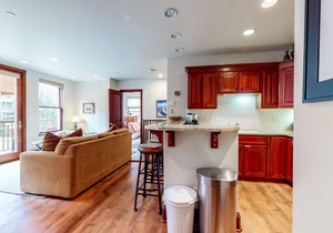 Two-story mountain condo with fireplace, grill & balcony