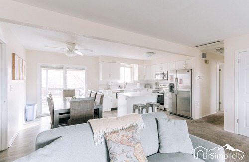Wheat Ridge Apartment | Bright & Chic Getaway Game Room Covered Deck