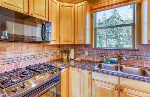 Wildernest Condo | Elegant & spacious home with fireplaces, deck & garage access