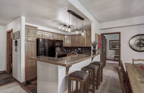 Four O'Clock Condo | Experience ski in/out cozy mountain living at Tyra Riverbend 213!