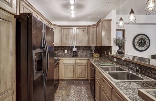 Four O'Clock Condo | Experience ski in/out cozy mountain living at Tyra Riverbend 213!