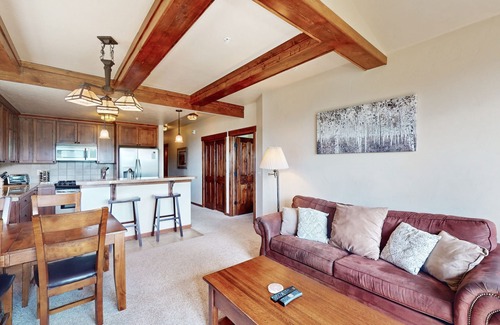 Fraser House | Mountain-view condo on ski shuttle route with deck & fireplace