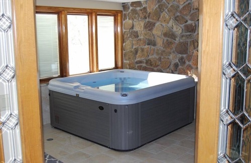 Mountain House Condo | New Private Hot Tub! Walk to Lifts, Log-Burning Fireplace, Warm and Cozy