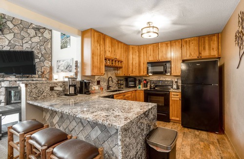 Mountain House Condo | Ski-in/ski-out home with pool, hot tub, sauna, washer/dryer, & private balcony