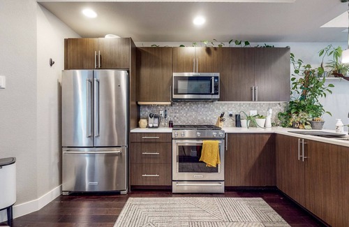 West Colfax House | Sloan Lake’s Rooftop Oasis | House with rooftop patio, firepit, hot tub, grill