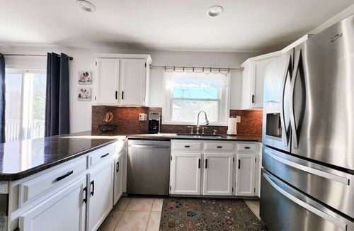 Aurora House | 4 Bedroom Home with 2 living rooms, patio, & backyard.