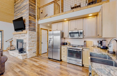 Bayfield House | Amazing lake view home with fireplace, W/D, kitchen, grill, balcony, and deck