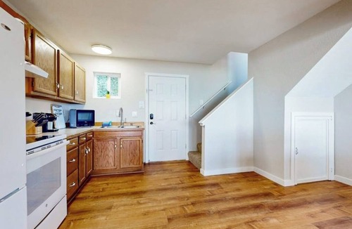 Clinton House | Beachfront Studio Retreat with Private Deck and Scenic Water Views