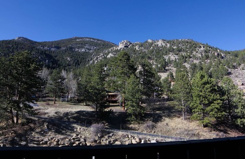 Estes Park Condo | Beautiful river and mountain views prevail from this 3-bedroom, 2-bath condo.