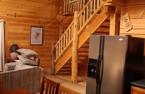 Lake City House | Bobcat Log home 4 bd 2 bth on the river waterfall view porch ATV drive-in/out