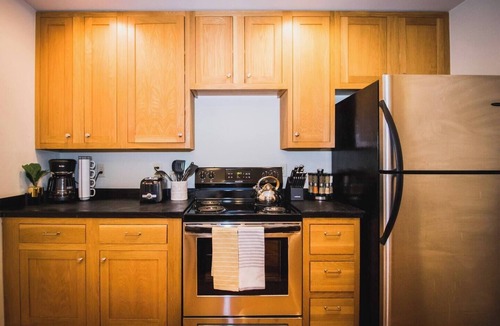 Greeley Apartment | Brick & Balcony Greeley Retreat