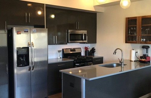 Steel Yards Apartment | Condo with deck facing the mountain, bike path and restaurant across the street, 5 min driving from down town