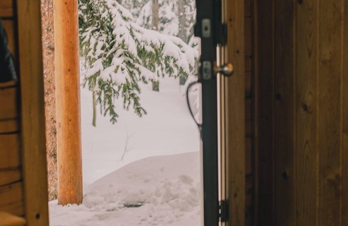Saint Mary's Cabin | Cozy Log Cabin: hot tub under the stars, private deck, king bed, dog friendly!