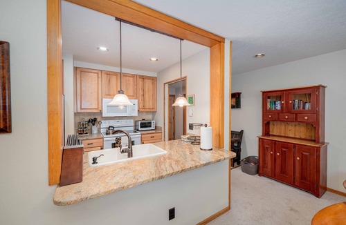 Lakeside Village Condo | Cozy, updated condo with lake views and ski shuttle right out front!