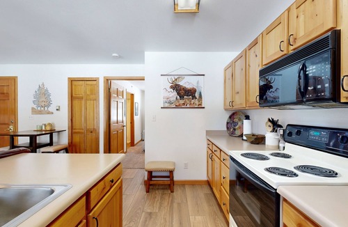 Grand Lake Condo | Creekside condo w/patio, fireplace & open layout perfect for a group getaway