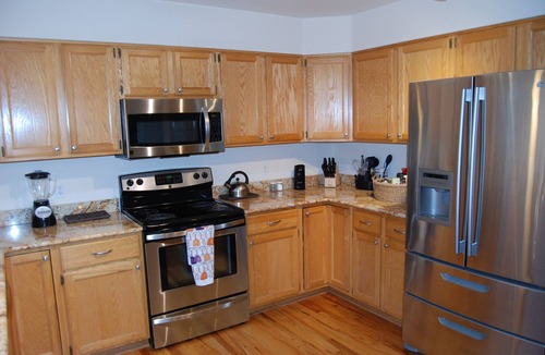 Northeast Colorado Springs House | Enjoy the large patio and shaded back yard of this large home with 2 kitchens
