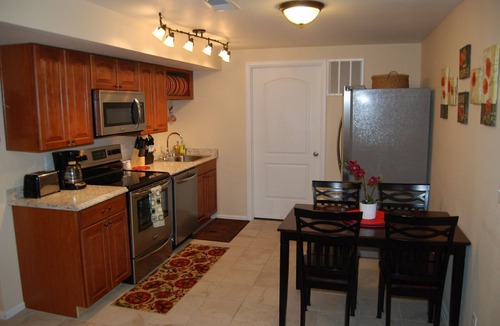 Northeast Colorado Springs House | Enjoy the large patio and shaded back yard of this large home with 2 kitchens