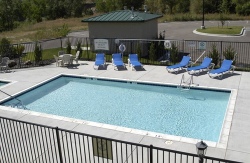 Northwest Colorado Springs Condo | Equipped Suite with FREE Breakfast, Outdoor Pool + Gym Access