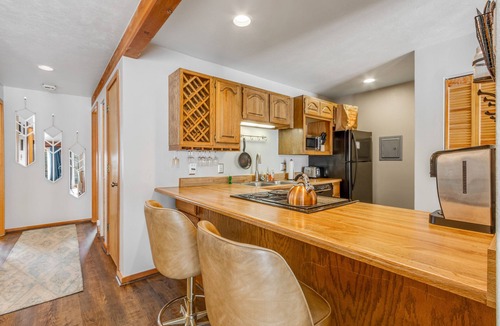 Wildernest Condo | First-floor condo with porch & electric fireplace - close to ski resorts
