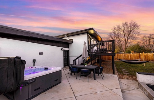 Lamar Heights Area House | Group friendly Denver home with hot tub, fire pit, large dining, & big backyard.
