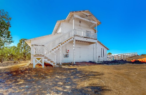 Marvel House | Idyllic rural home with private pond, river access, pool, patio, & covered decks