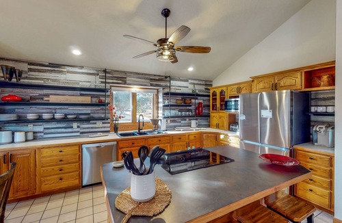 Greeley House | Lake-view home with gas fireplaces, inviting deck & dog-friendly yard