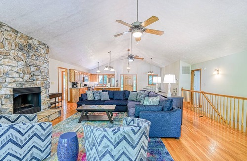 Livingston House | Lakefront with deck, hot tub, game room, kayaks, & fireplace