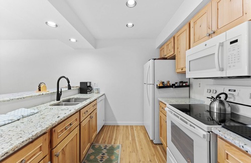Lakeside Village Condo | Lakeside Village Condo w/Private Patio for Mountain Views & Shared Hot Tub!