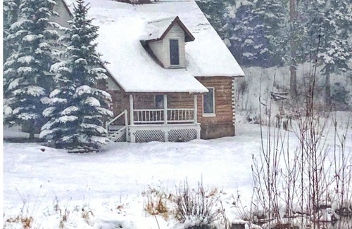 Highland Meadows Cabin | Lena's Cabin in Vail is nestled right beside Gore Creek, minutes from skiing.