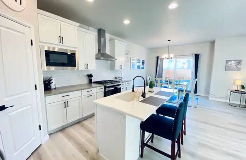 Milliken House | Modern home with a large fenced yard, and garage access
