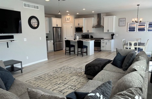 Milliken House | Modern home with a large fenced yard, and garage access