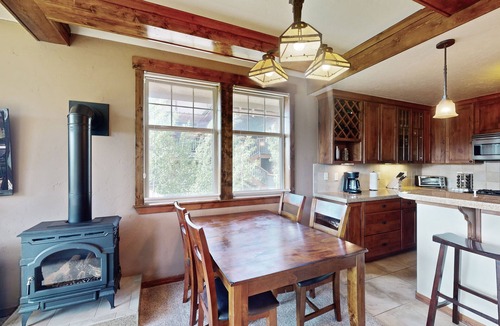 Fraser House | Mountain-view condo on ski shuttle route with deck & fireplace