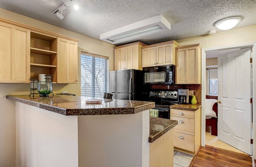 Englewood Condo | Partial view of Rocky Mountains from balcony!