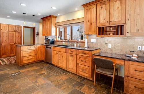 Broadmoor House | Relaxing Home with Private Hot Tub, Fast WiFi, Gas Fireplace, and Washer/Dryer