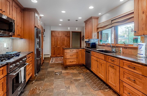 Broadmoor House | Relaxing Home with Private Hot Tub, Fast WiFi, Gas Fireplace, and Washer/Dryer