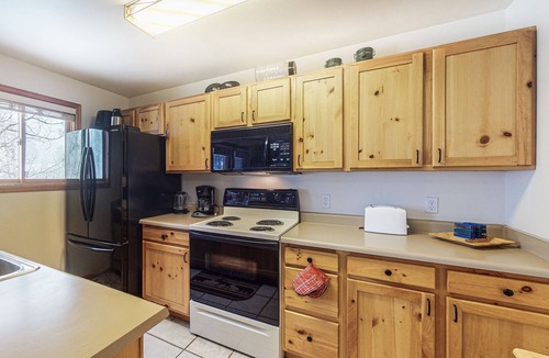 Grand Lake Condo | Riverfront condo with free wifi, fireplace, patio, & gas grill