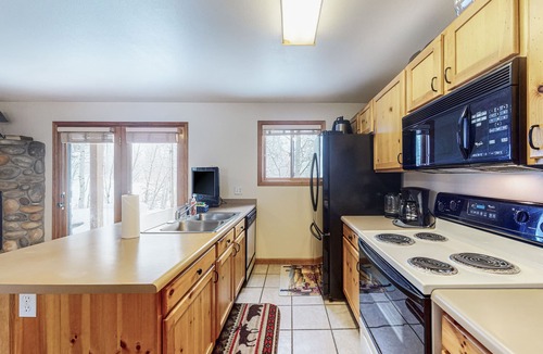 Grand Lake Condo | Riverfront condo with free wifi, fireplace, patio, & gas grill