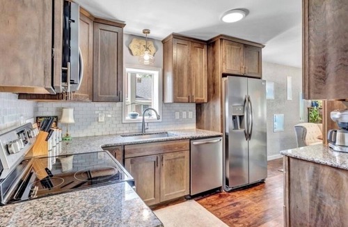 Central Colorado Springs House | Sink into the Hot Tub and start relaxing at the beautiful, bright Cedar House
