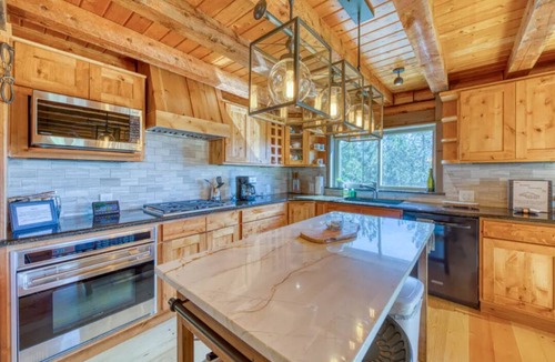 Woodland Park Cabin | Spacious cabin in the woods w/a private hot tub, deck, & fireplace SUV needed