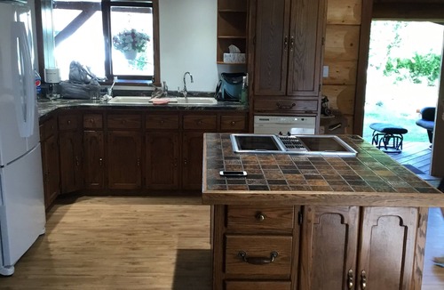 Swift Current House | Three level Log Home on Private 40 Acre Estate.
