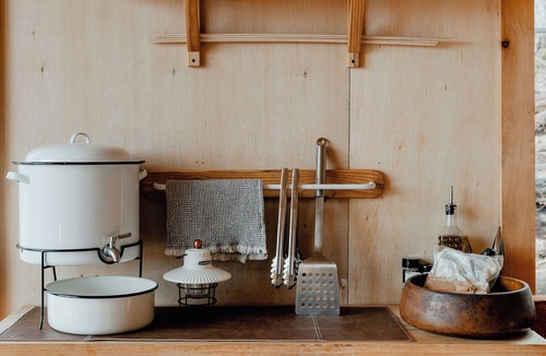 Liberty Cabin | Tiny cabin amongst trees on a farm with alpacas