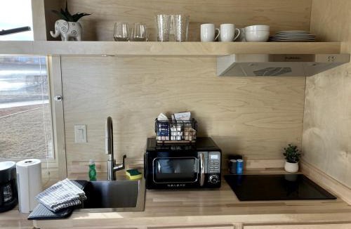 Pear Park House | Tranquil Tiny House Hideaway in Colorado: Peaceful Waterside Bliss in Grand Junction