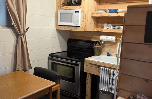 Cedaredge Cabin | Unit 2: King Bed Suite with Full Kitchen at the Cedaredge Lodge